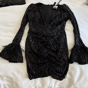 Black sequin and feather dress